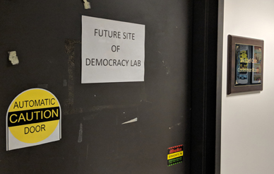office door with "future site of democracy lab" sign posted