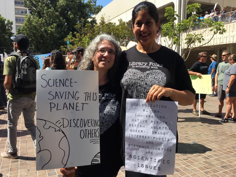 Rachel Myers and Gayatri holding signs at the March for Science 2016
