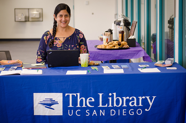 Gayatri sits at the UC San Diego Geisel Library desk