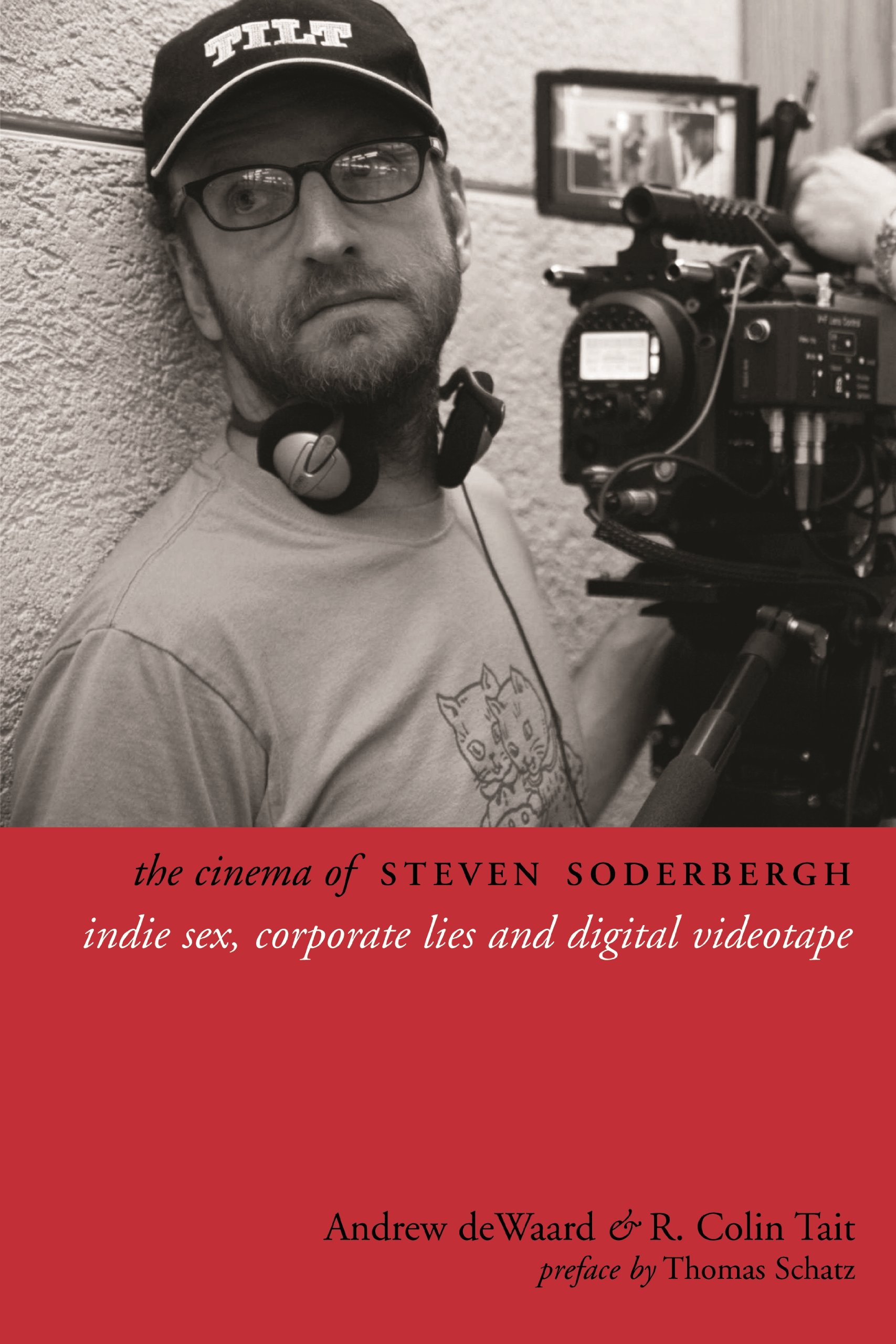 book cover featuring a black and white photo of steven soderbergh wearing a baseball cap, holdinga camera, and leaning against a wall