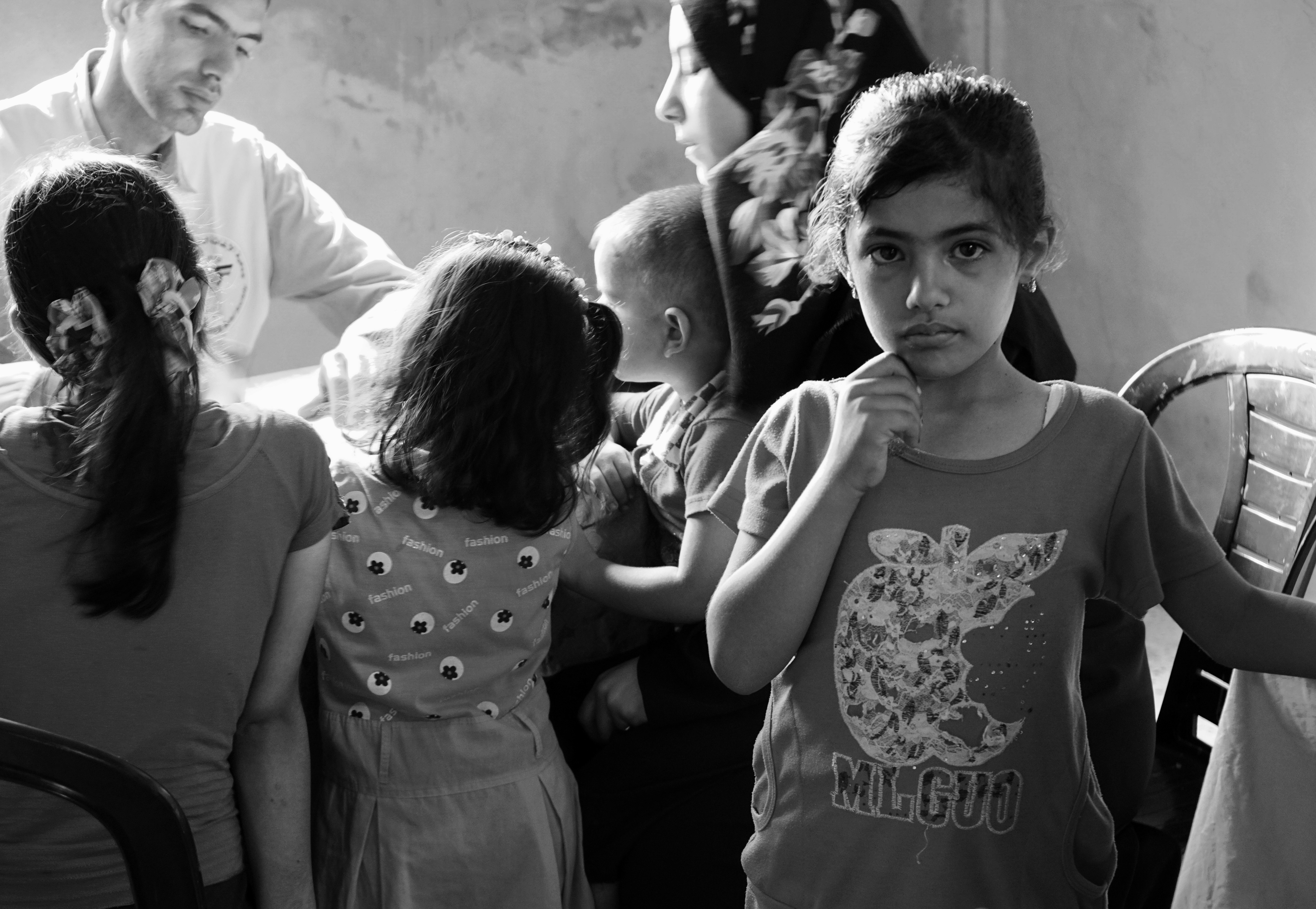 Family being treated in a mobile clinic of the Palestinian Medical Relief Society in Bayt Hanun, Gaza Strip  (2015).  Photo by Gary Fields